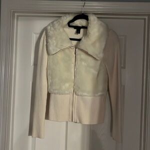 Ivory sweater with fur accent. No belt. Excellent used condition.